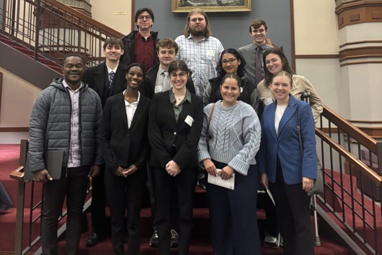 Economic students posed on staircase