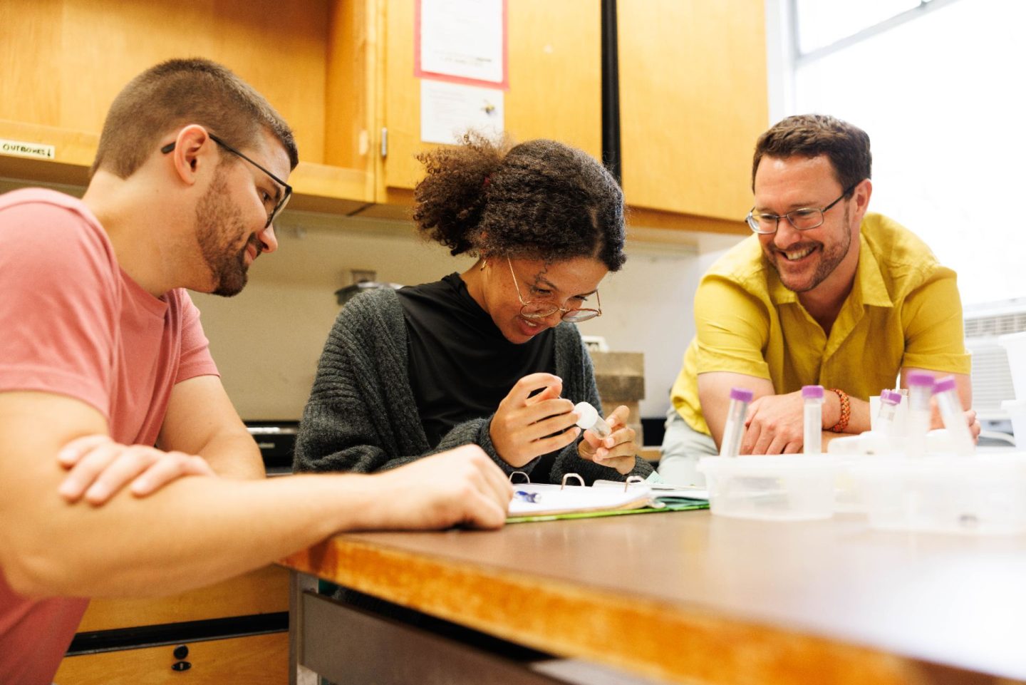Amélie Mwilambwe, center, has been getting an early start on research in Dr. Ben Sadd's lab. Sadd, right, and Dr. Logan Sauers, left, have been mentoring her through a project for which she received grant support.